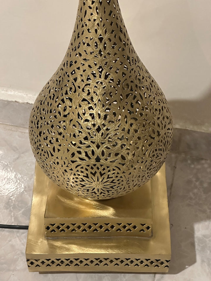 Side angle of Jawahir Moroccan lamp showing graceful silhouette and handcrafted construction.