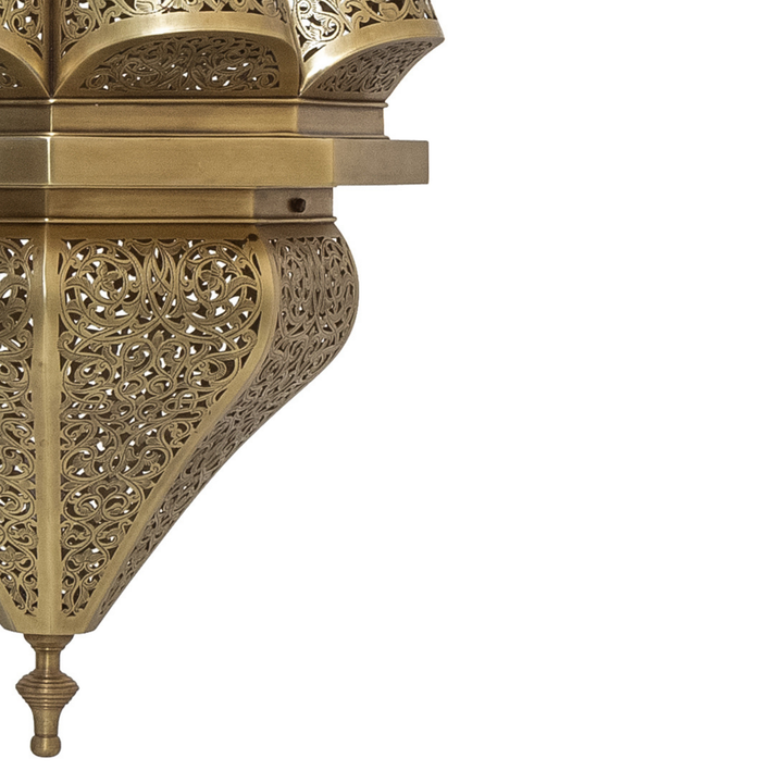 Amira handcrafted brass fixture with rounded pendant form and gentle illumination for dining spaces and refined home decor.