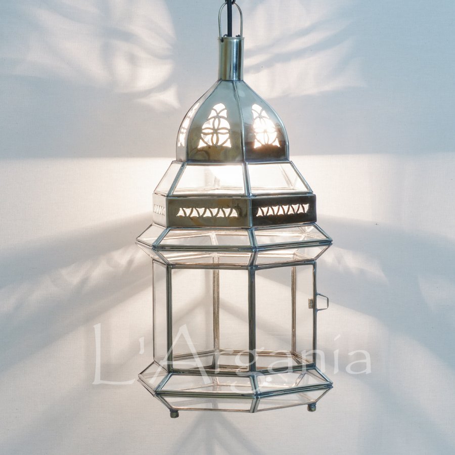 Aziza Silver lantern with vintage glass panels styled for boutique interiors and hotel patios.