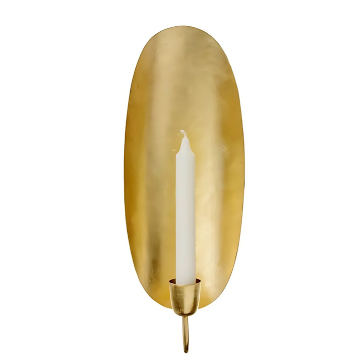 Brass Candle Holder Oval with warm candle glow and handcrafted Moroccan detail for elegant table and shelf decor