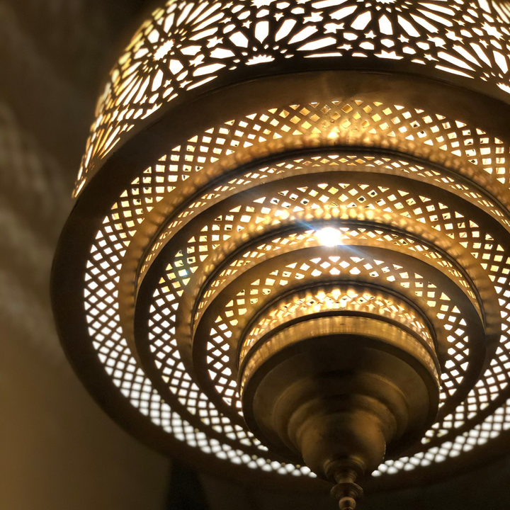 Bottom view of Ibrahim Parchment ceiling light showing warm shade finish and gentle illumination below.