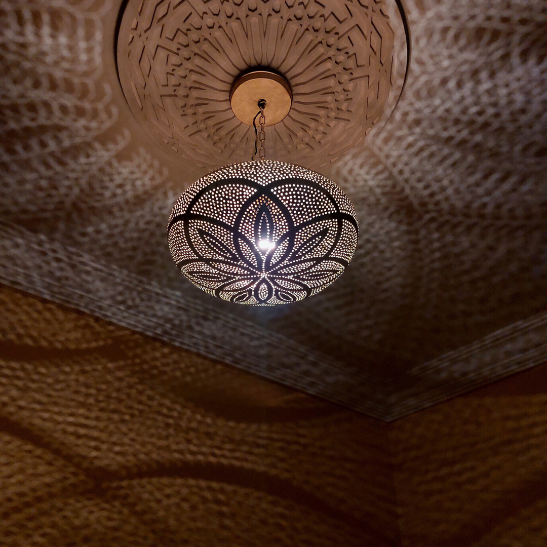Khalil brass ceiling light with pendant lamp detail creating warm Moroccan glow for dining rooms and bedroom ceilings.