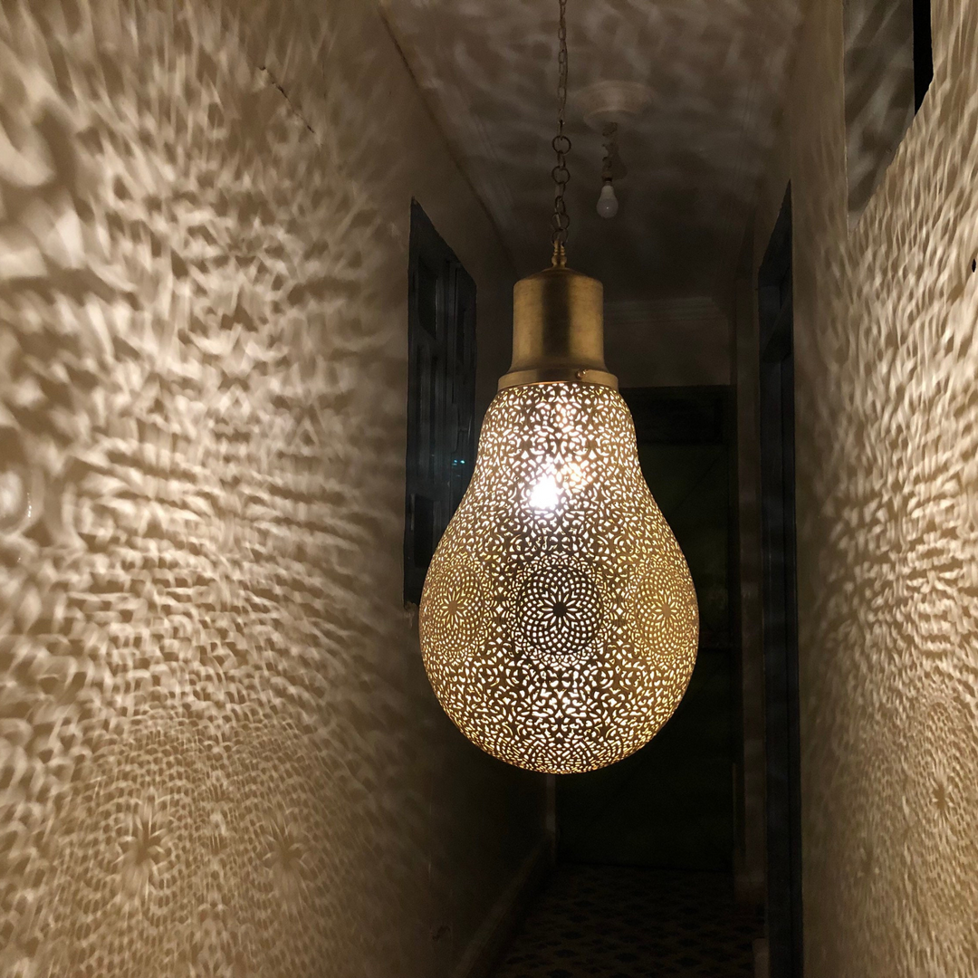 Brass Ceiling Light Lightbulb with soft brass radiance and rounded bulb shape for warm Moroccan room lighting