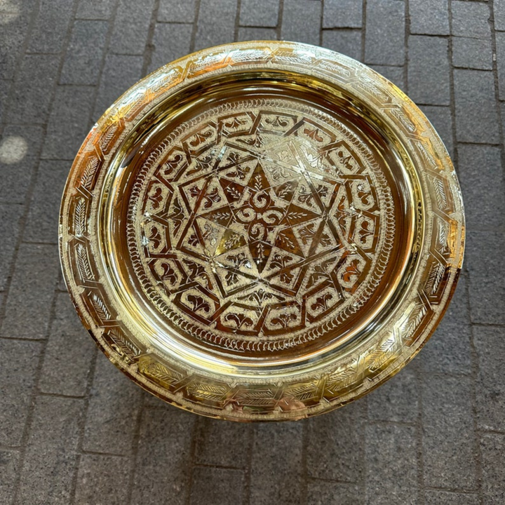 Moroccan Hand Engraved Tray Dehbi with golden brass surface, detailed motifs, and graceful decorative table appeal