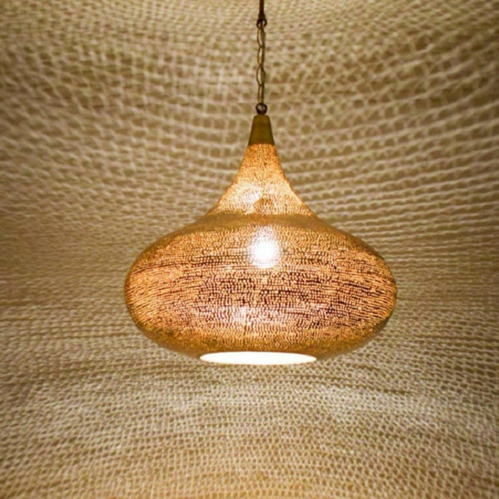 Iman brass hanging light with traditional Moroccan detail for soft filtered illumination in bedrooms and entry spaces.