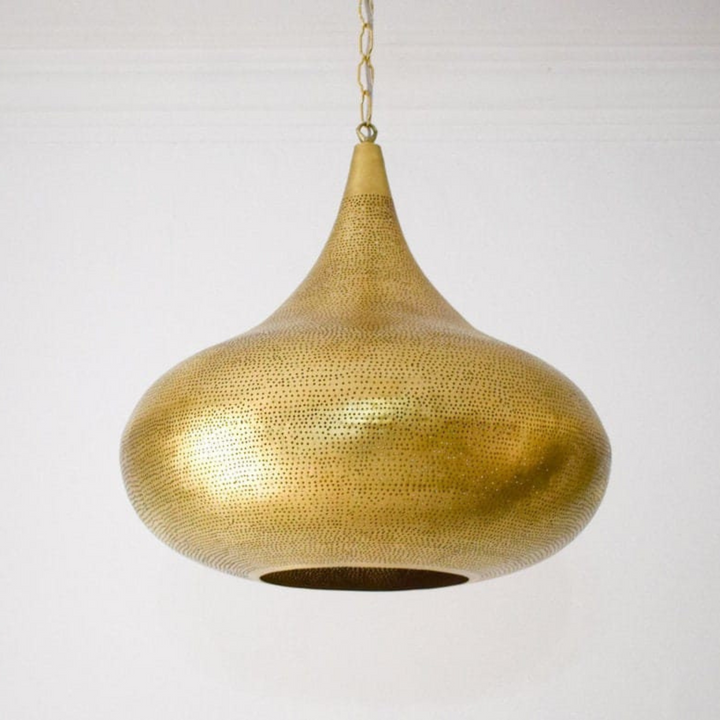 Iman antique brass pendant with Moroccan detailing for soft ceiling light in riads, corridors, and welcoming entry areas.