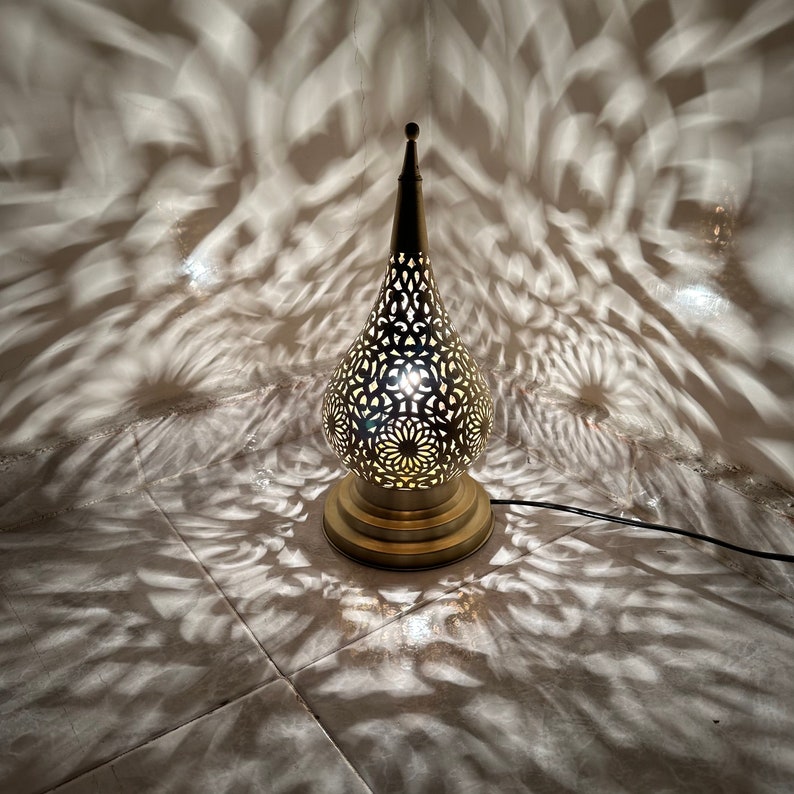 Jana brass table and floor lamp with handmade metalwork for warm decorative lighting in elegant rooms.