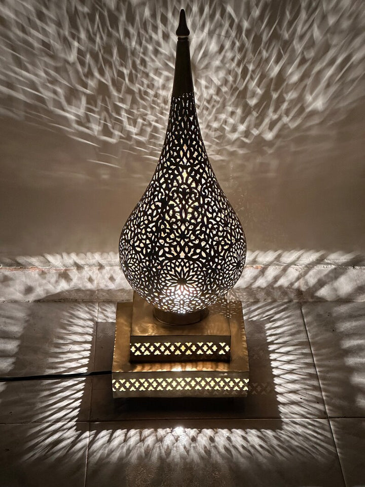 Jawahir floor light styled near seating areas to create soft ambience for villas and lounge corners.