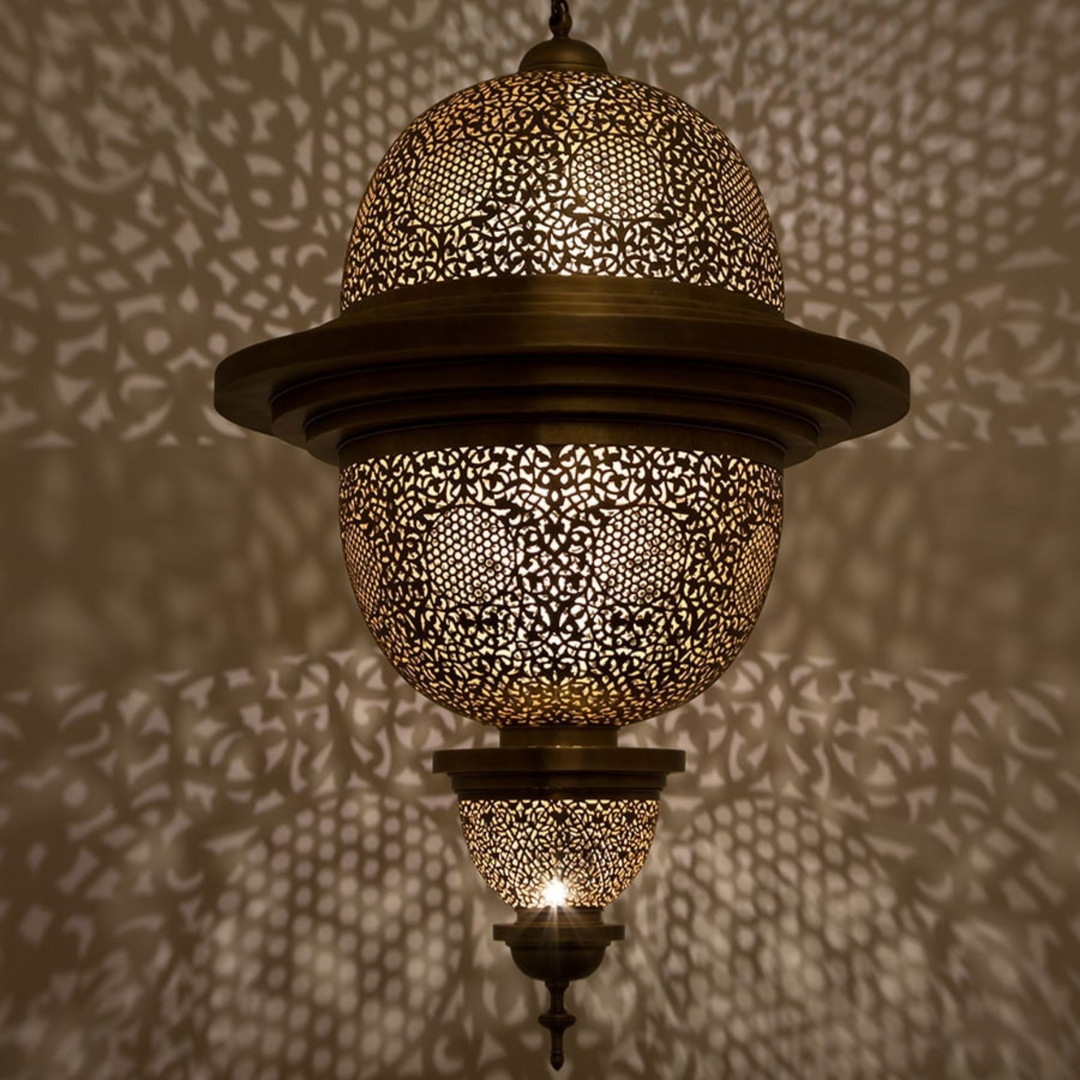 Kawthar brass ceiling light with polished pendant shape and warm golden glow for dining rooms, bedrooms, and elegant interiors.