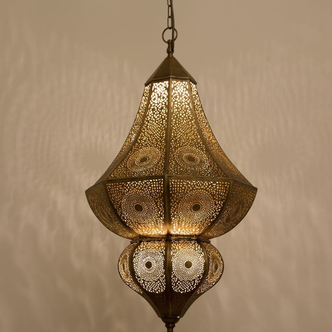 Maya brass ceiling light with handcrafted pendant form and warm golden glow for dining rooms, bedrooms, and Moroccan interiors.