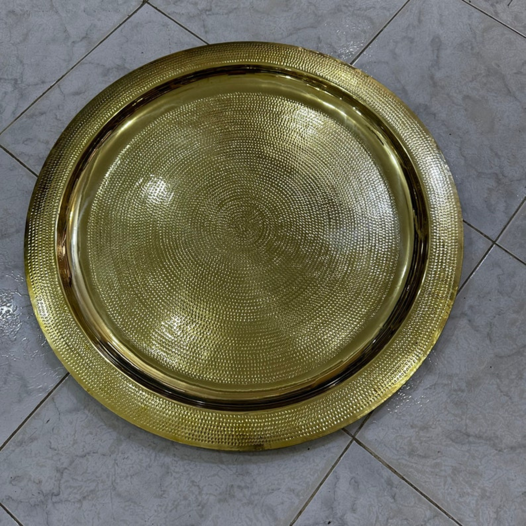 Moroccan Hand Engraved Tray Hamsa used as a centerpiece with intricate brass design and elegant cultural styling