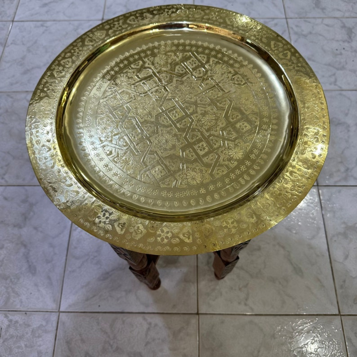 Moroccan Hand Engraved Tray Zwina used as a centerpiece with detailed brass design and refined table presentation