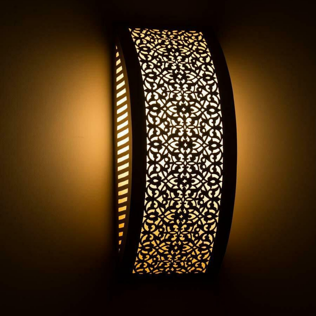 Brass Wall Sconce Ghalia casting soft shadow effects through Moroccan brasswork for bedrooms, corridors, and lounge walls