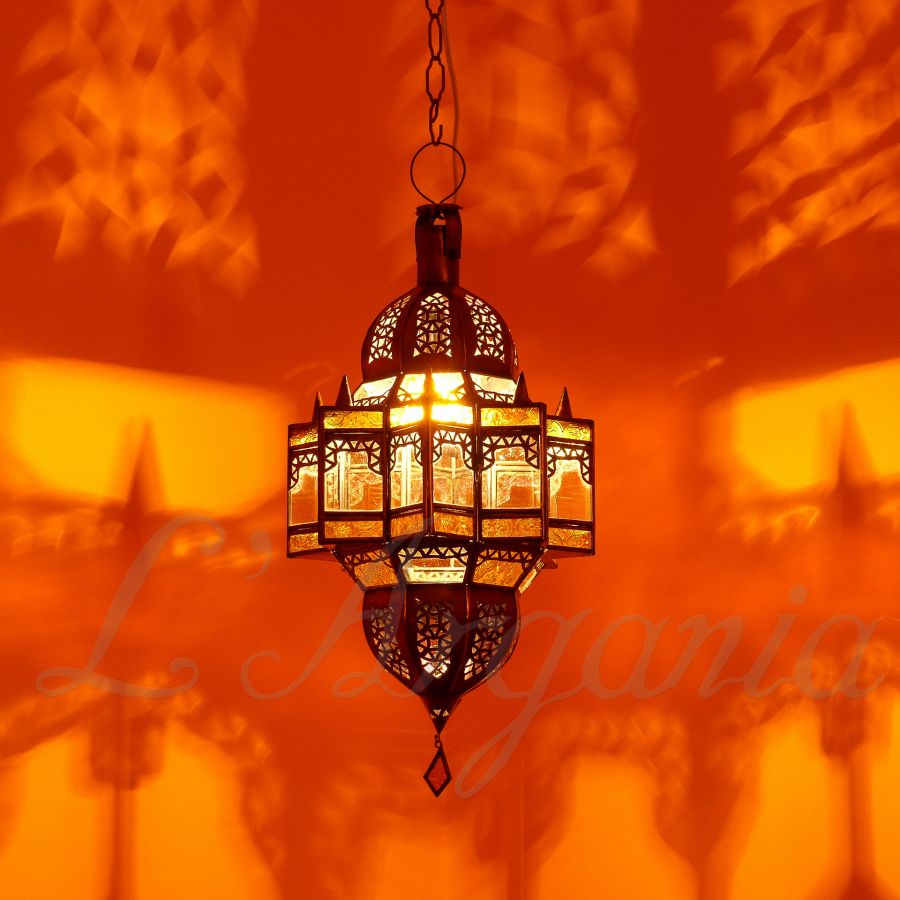 Mqenta Mandarine Moroccan lamp creating a soft amber glow for restaurant corners and terrace seating.