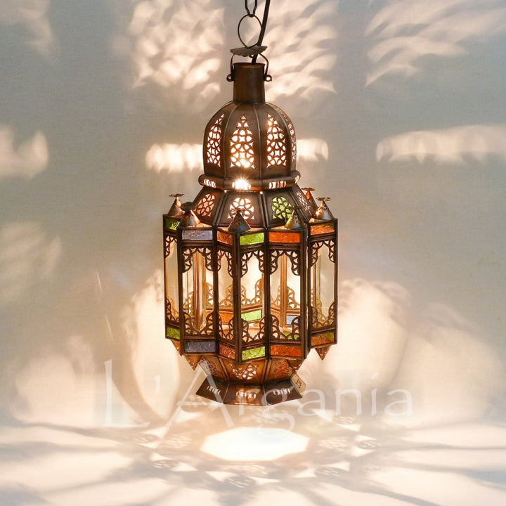 Mqenta Mini lantern with compact glass panels and handmade Moroccan metal frame for small patio decor.