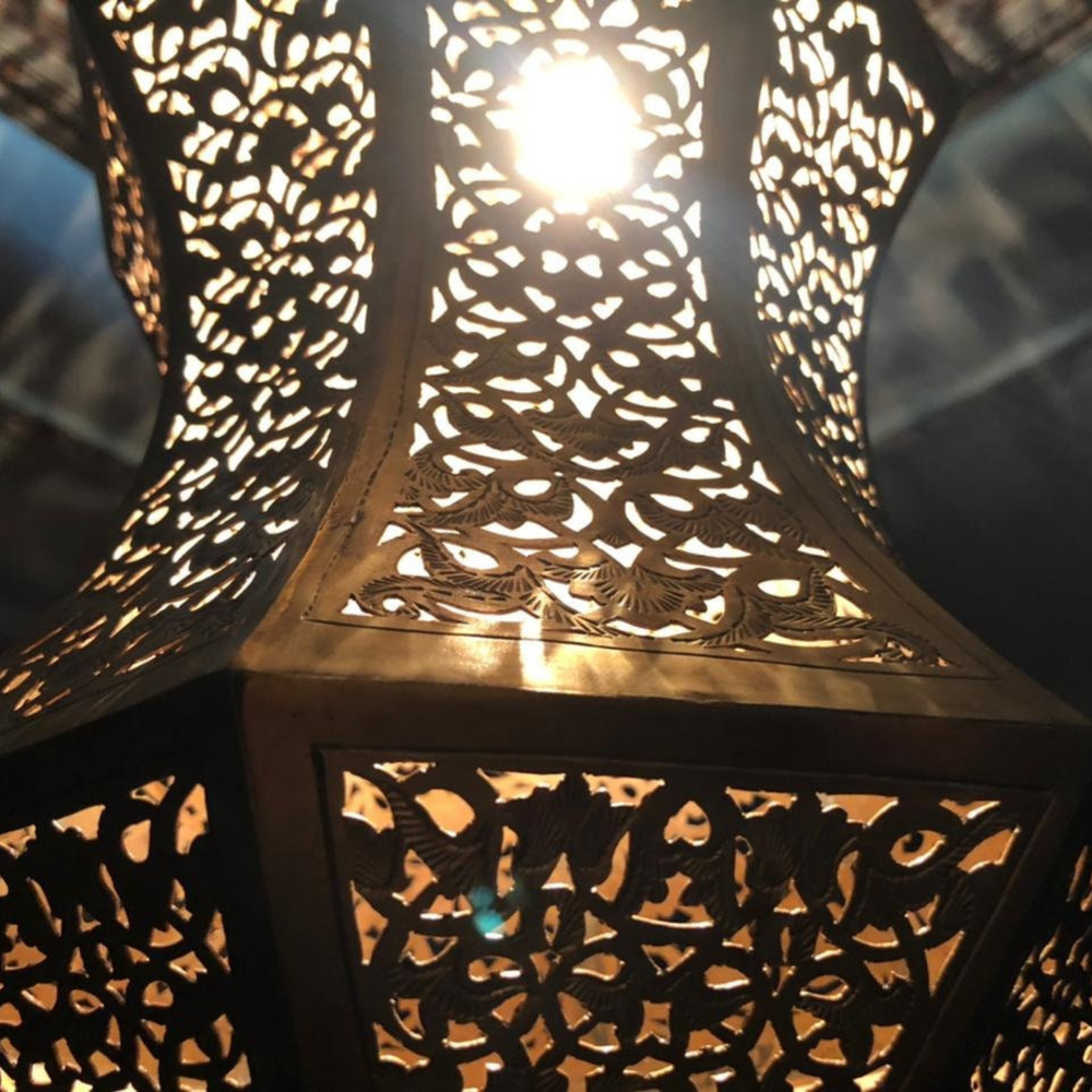 Close view of Najwa Moroccan pendant shade showing pierced brass details and smooth crafted metal surface.