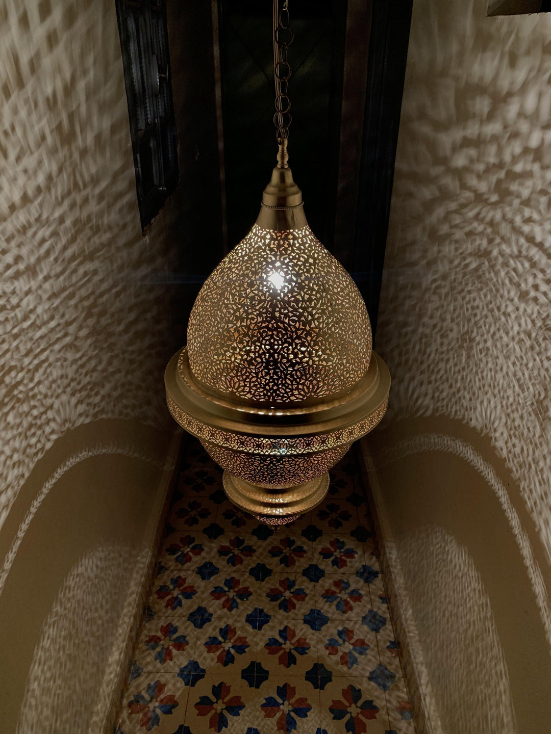 Brass Ceiling Light Nassim XL used as a room statement with large brass shade and soft decorative illumination