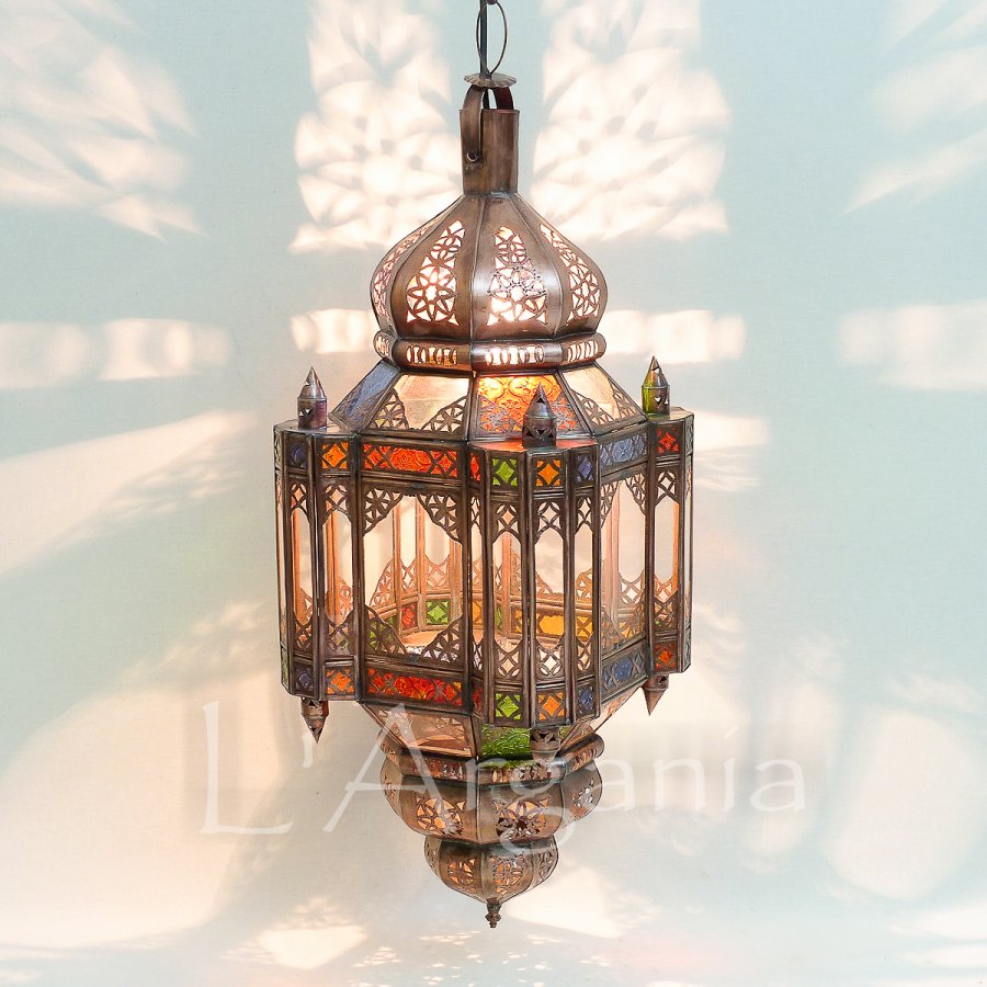 Nayira Khalid lantern with Moorish glass panels and brass frame arranged for hotel interiors.