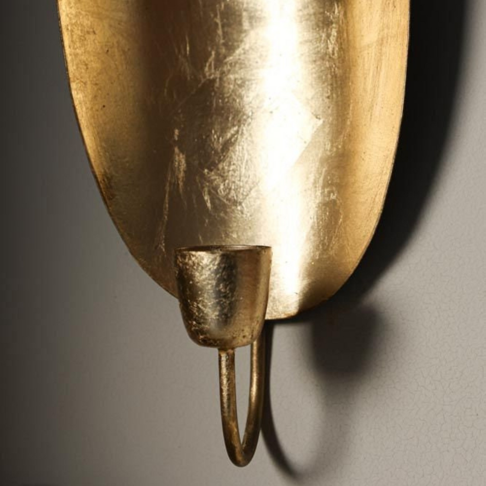Brass Candle Holder Oval styled on a table with polished brass finish and soft light for Moroccan home decoration