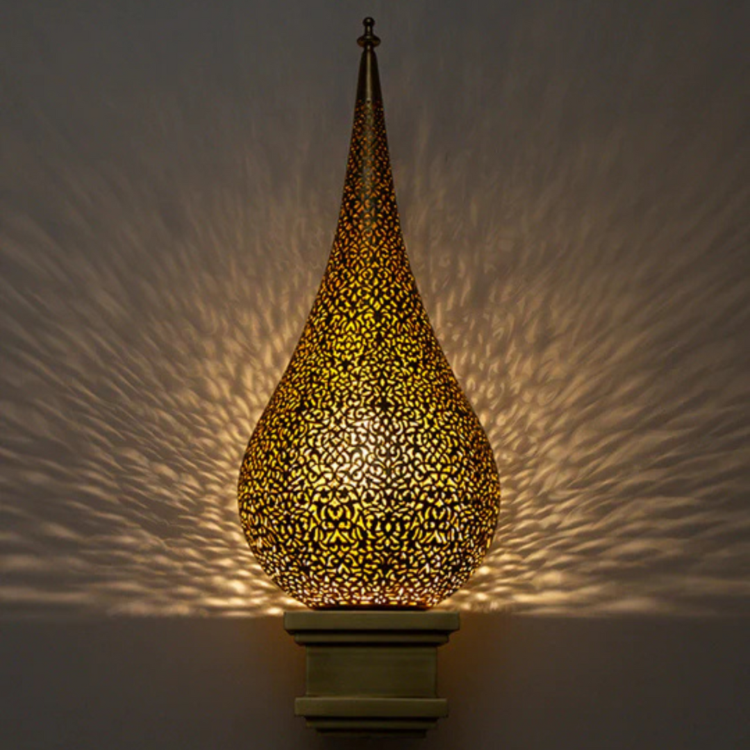 Riad brass wall sconce with handmade texture for golden corridor lighting.