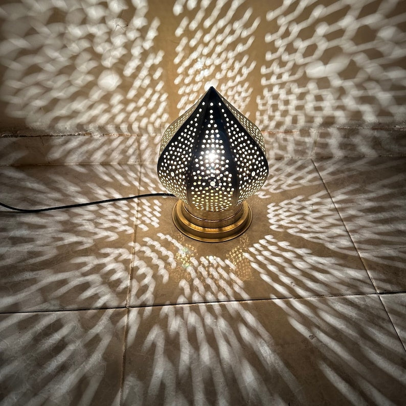 Yoyo brass table and floor lamp adds a playful metal form and warm decorative light to hotels, boutiques, lounges, and Moroccan interiors.